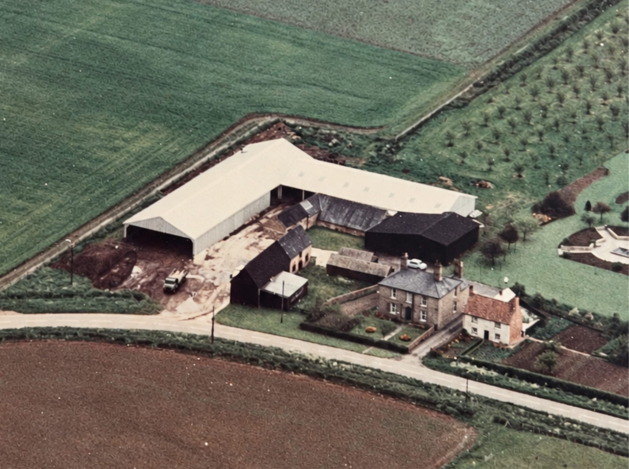 The Eynesbury yard from the air in its early years, a farmhouse and barns among fields
