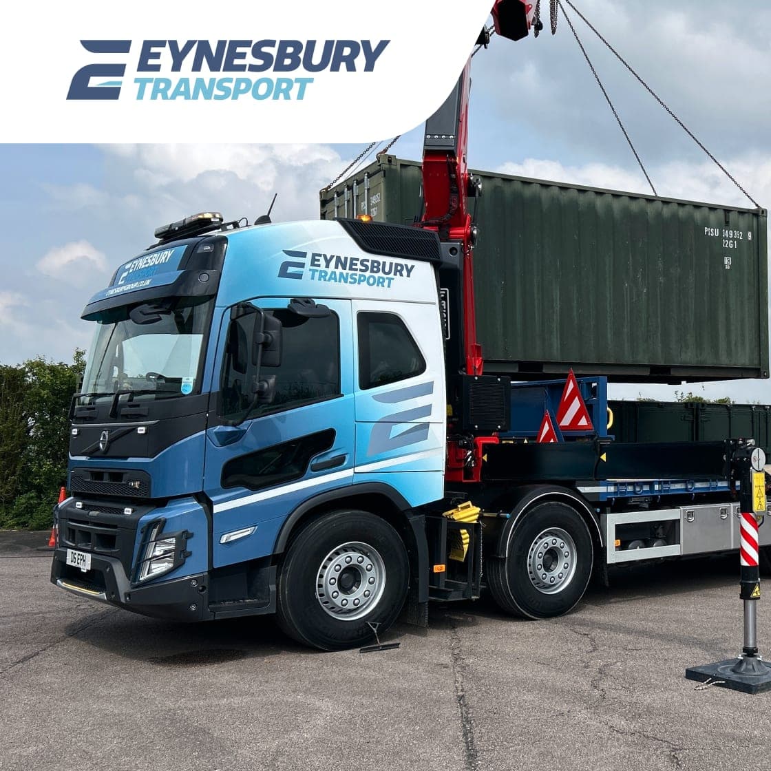 An Eynesbury Transport crane lorry lifting a shipping container