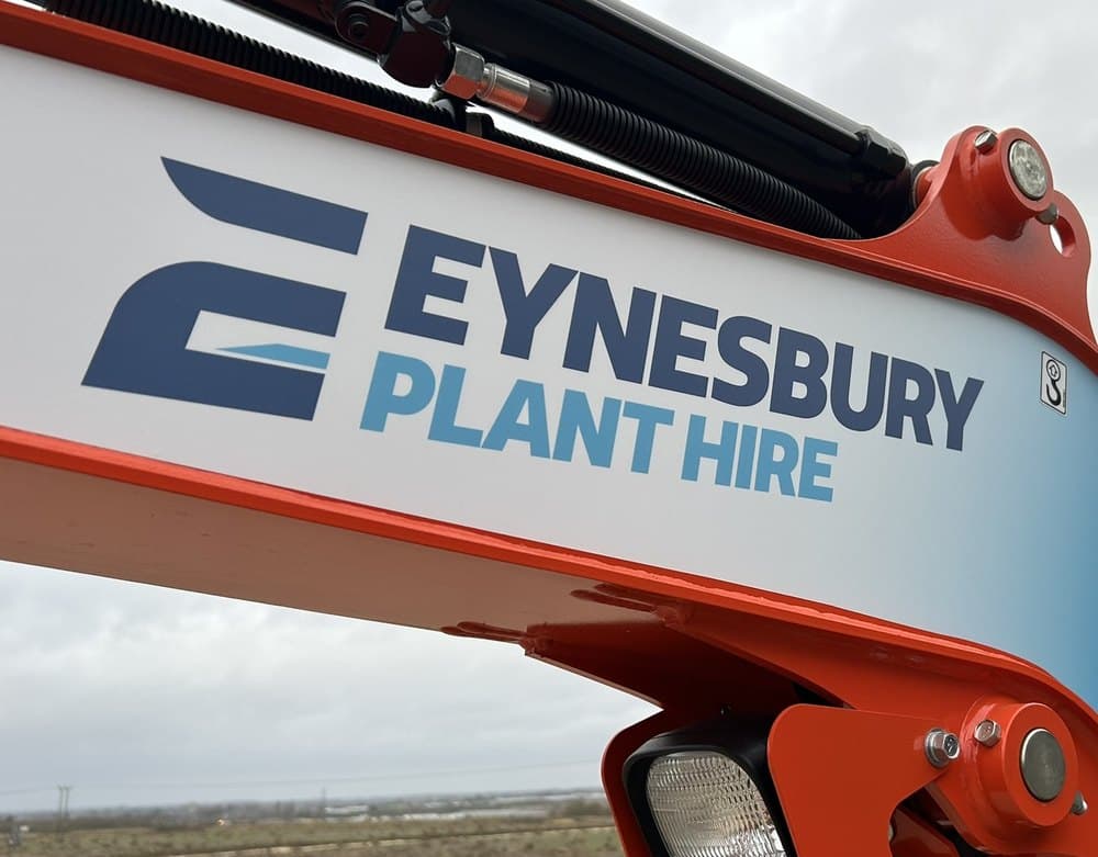 The Eynesbury Plant Hire logo on a digger arm