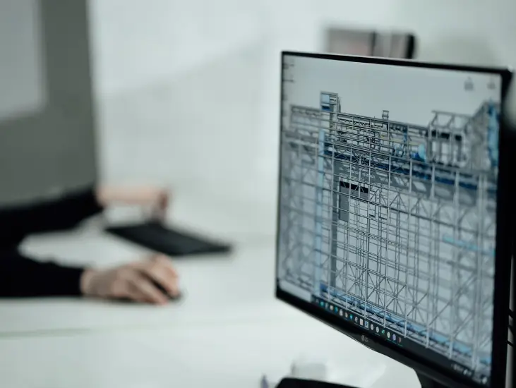 Image of a pc monitor with construction technology on the screen