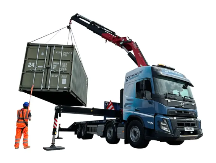 Image of a container being lifted on to a lorry at Eynesbury Transport